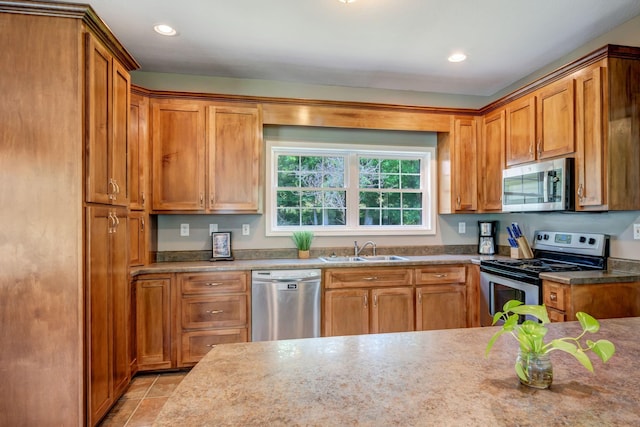 80 Latimer Cemetery Ln, Waverly, TN 37185 - kitchen with appliances with stainless steel finishes, a sink, brown cabinetry, and recessed lighting