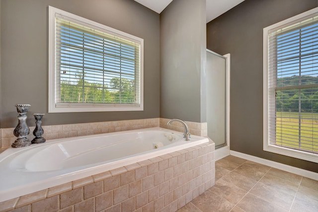 80 Latimer Cemetery Ln, Waverly, TN 37185 - bathroom featuring a bath, a stall shower, tile patterned floors, and baseboards