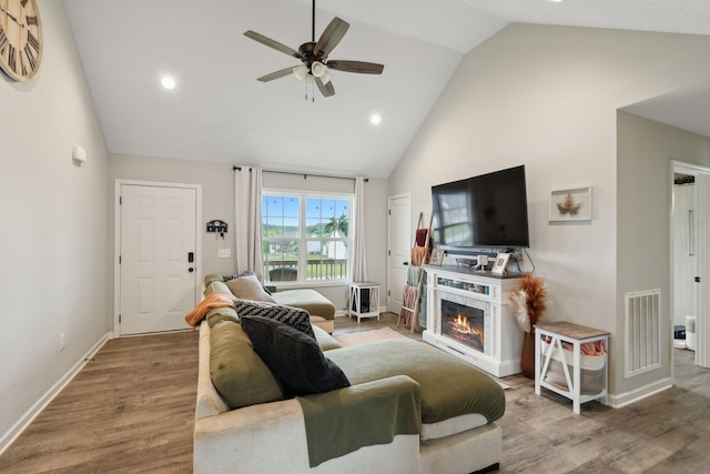 611 Annas Way, Lewisburg, TN 37091 - living area featuring high vaulted ceiling, wood finished floors, ceiling fan, a glass covered fireplace, and recessed lighting