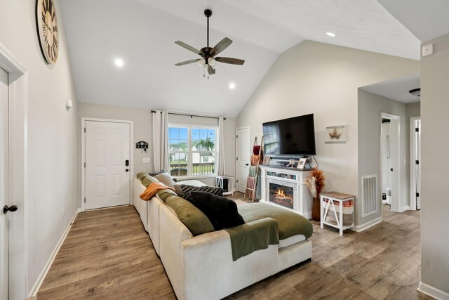 611 Annas Way, Lewisburg, TN 37091 - living room with high vaulted ceiling, a ceiling fan, wood finished floors, baseboards, and a glass covered fireplace