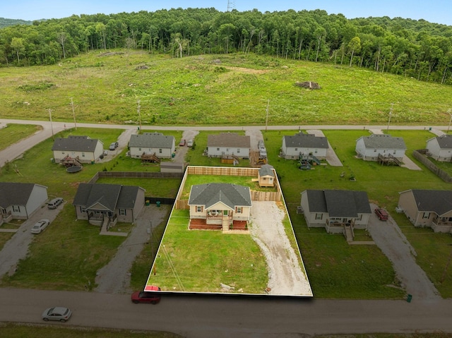 611 Annas Way, Lewisburg, TN 37091 - aerial perspective of suburban area with property parcel outlined and a heavily wooded area