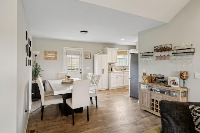 611 Annas Way, Lewisburg, TN 37091 - dining area featuring light wood-style flooring, a bar, and recessed lighting