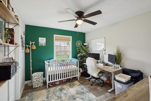 611 Annas Way, Lewisburg, TN 37091 - bedroom with a desk, wood finished floors, a crib, and a ceiling fan