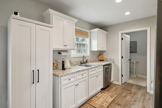 611 Annas Way, Lewisburg, TN 37091 - kitchen with dishwasher, a sink, light wood finished floors, white cabinets, and light countertops