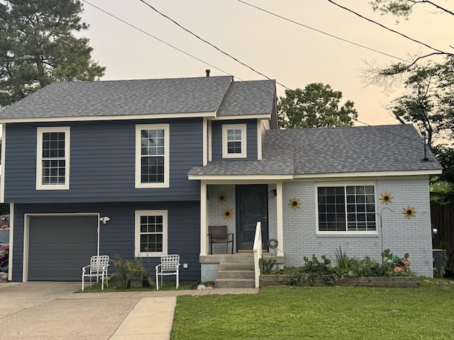 408 Brannon Hill Ct, Old Hickory, TN 37138 - tri-level home with a garage, a front lawn, concrete driveway, roof with shingles, and brick siding