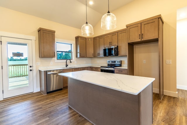 5359 Roy Holman Rd, Springfield, TN 37172 - kitchen featuring stainless steel appliances, a sink, light stone counters, pendant lighting, and dark wood finished floors