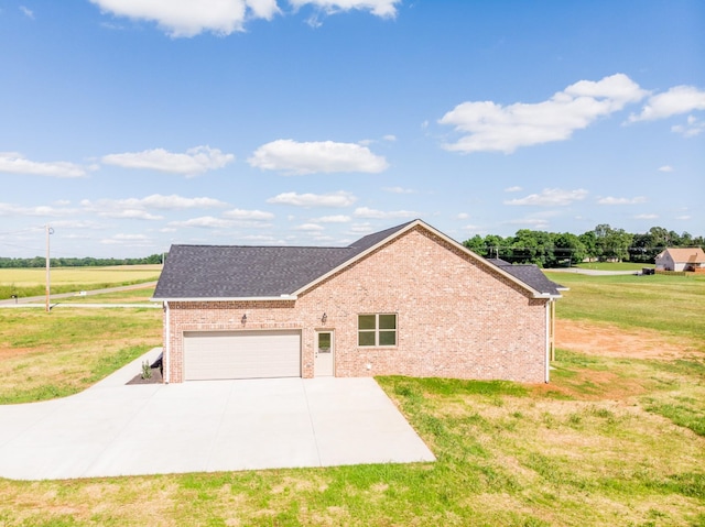 5359 Roy Holman Rd, Springfield, TN 37172 - view of home's exterior with brick siding, concrete driveway, a lawn, a garage, and a shingled roof