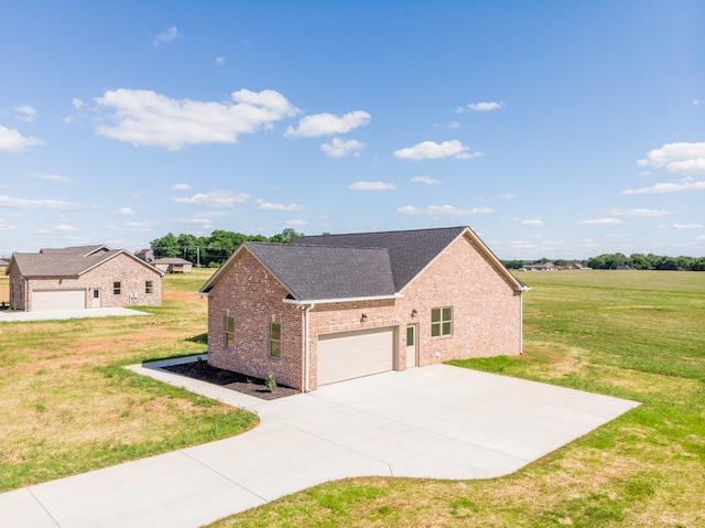 5359 Roy Holman Rd, Springfield, TN 37172 - view of home's exterior featuring brick siding, a lawn, concrete driveway, an attached garage, and roof with shingles