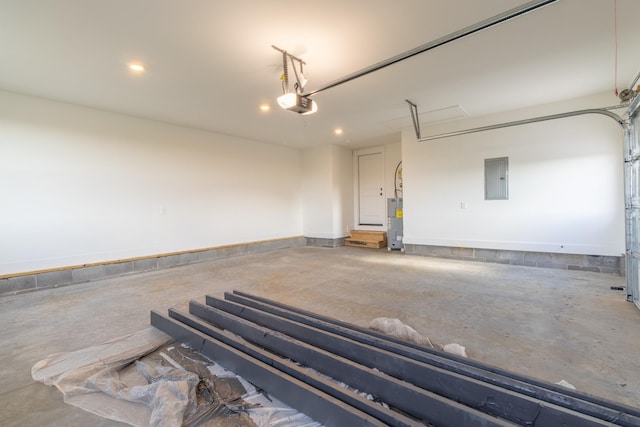 5359 Roy Holman Rd, Springfield, TN 37172 - garage featuring electric panel, electric water heater, a garage door opener, and recessed lighting