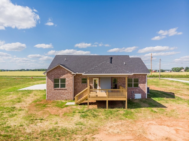 5359 Roy Holman Rd, Springfield, TN 37172 - back of house with brick siding, a shingled roof, a wooden deck, and a lawn