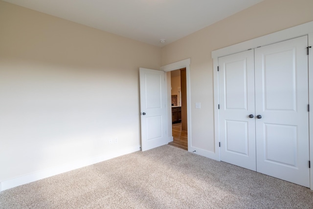5359 Roy Holman Rd, Springfield, TN 37172 - unfurnished bedroom featuring carpet flooring, baseboards, and a closet