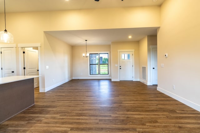 5359 Roy Holman Rd, Springfield, TN 37172 - unfurnished living room featuring dark wood finished floors, baseboards, and recessed lighting
