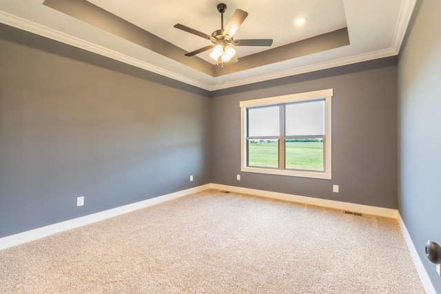 5359 Roy Holman Rd, Springfield, TN 37172 - empty room featuring a raised ceiling, carpet, ornamental molding, baseboards, and a ceiling fan
