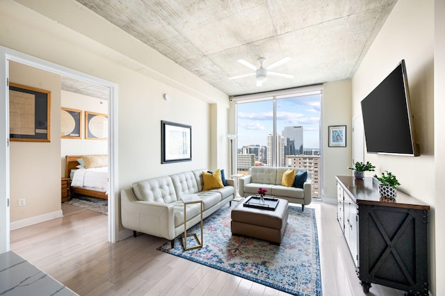 415 Church St Unit 2212, Nashville, TN 37219 - living room with wood finished floors, ceiling fan, and baseboards