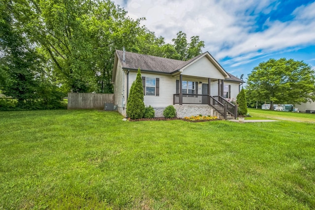 1435 Silver Creek Rd, Lewisburg, TN 37091 - view of front facade with covered porch, roof with shingles, and central AC unit