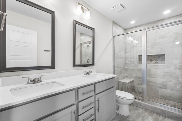 231 Donegal Dr, Clarksville, TN 37042 - bathroom featuring toilet, a stall shower, double vanity, and recessed lighting