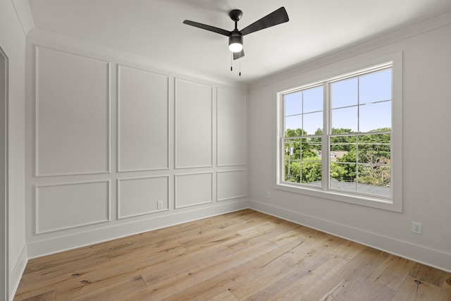1701 Portland Ave Unit C, Nashville, TN 37212 - empty room featuring baseboards, light wood-style floors, a ceiling fan, and a decorative wall