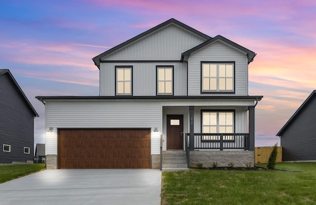 1013 Cherry Acres Dr, Clarksville, TN 37042 - view of front of property with a porch, concrete driveway, and a lawn