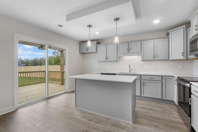 1013 Cherry Acres Dr, Clarksville, TN 37042 - kitchen featuring stainless steel range with electric stovetop, gray cabinets, a sink, recessed lighting, and light wood-style flooring