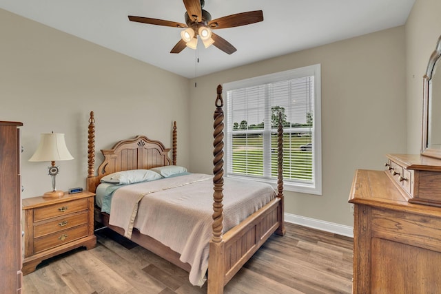 1006 Twilight Dr, Castalian Springs, TN 37031 - bedroom with baseboards, light wood finished floors, and a ceiling fan