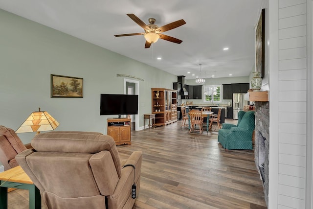 1006 Twilight Dr, Castalian Springs, TN 37031 - living room featuring a ceiling fan, wood finished floors, recessed lighting, baseboards, and a stone fireplace