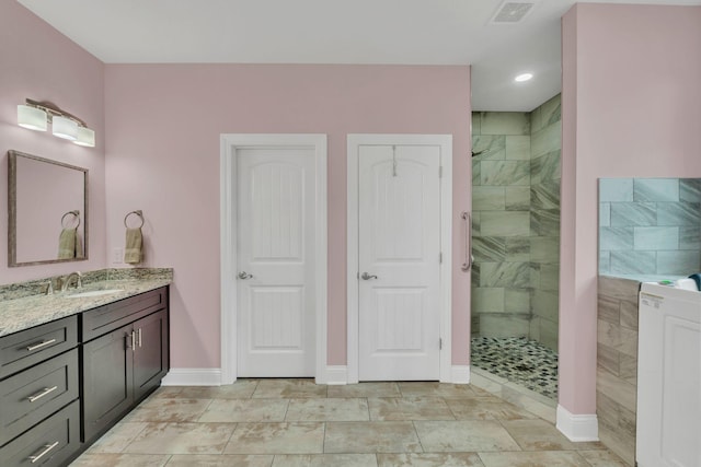 1006 Twilight Dr, Castalian Springs, TN 37031 - full bath with vanity, a tile shower, baseboards, and recessed lighting
