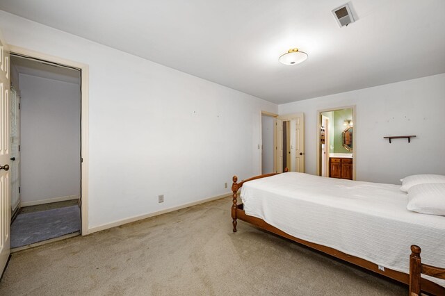 412 Benton Ln, Franklin, TN 37067 - carpeted bedroom featuring baseboards and connected bathroom