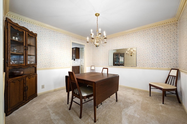 412 Benton Ln, Franklin, TN 37067 - dining area with a chandelier, ornamental molding, wainscoting, wallpapered walls, and light carpet