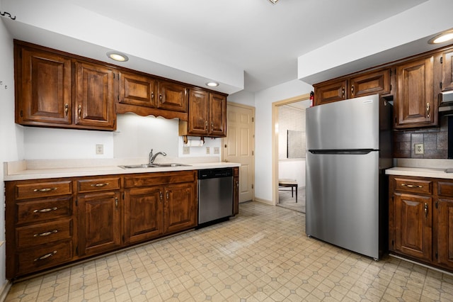 412 Benton Ln, Franklin, TN 37067 - kitchen featuring stainless steel appliances, a sink, light countertops, recessed lighting, and baseboards