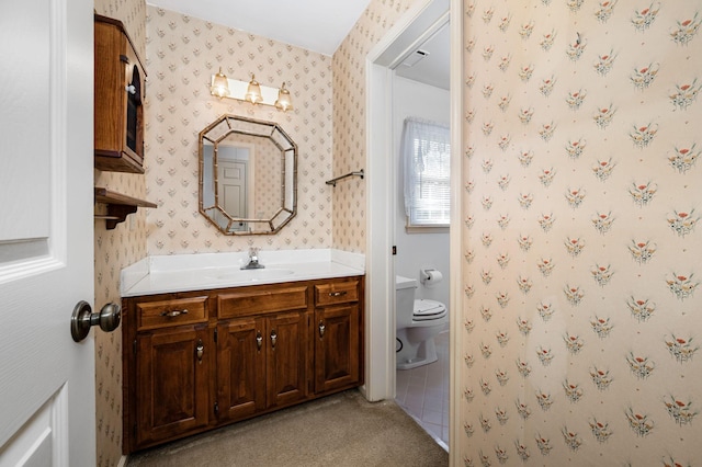 412 Benton Ln, Franklin, TN 37067 - bathroom with wallpapered walls, vanity, and toilet