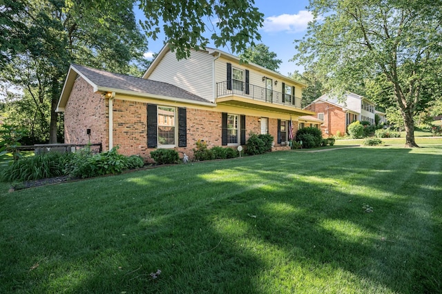 412 Benton Ln, Franklin, TN 37067 - traditional-style home featuring a balcony, brick siding, a front lawn, and a shingled roof