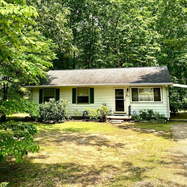 184 N Bluff Cir, Monteagle, TN 37356 - view of front of home with a front lawn and a carport