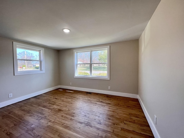 715 Hunt St, Winchester, TN 37398 - empty room featuring dark wood-style flooring, baseboards, and recessed lighting