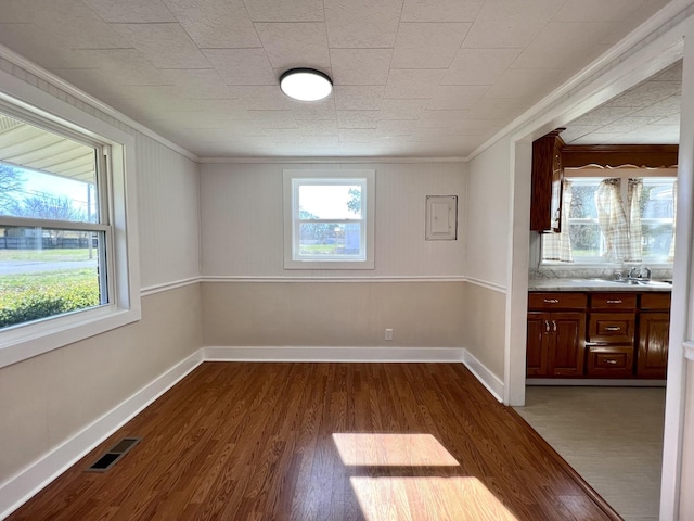 715 Hunt St, Winchester, TN 37398 - unfurnished room featuring crown molding, dark wood-style floors, and baseboards
