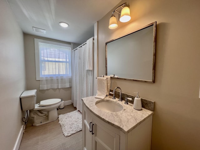 715 Hunt St, Winchester, TN 37398 - bathroom featuring baseboards, toilet, vanity, and tile patterned floors