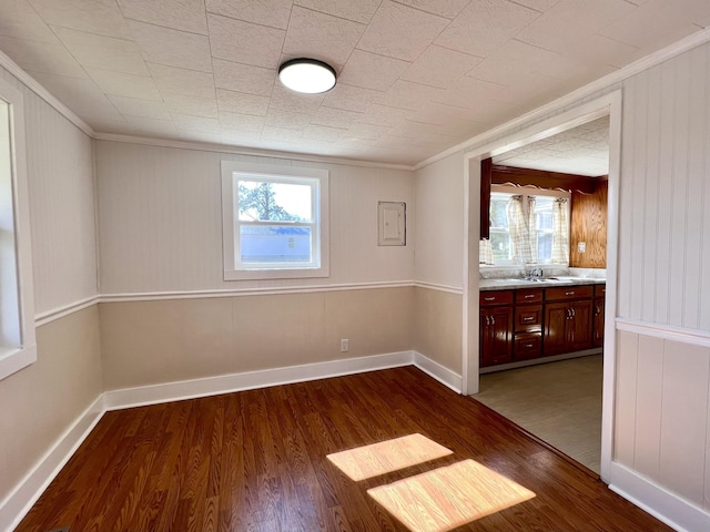 715 Hunt St, Winchester, TN 37398 - empty room with dark wood-style flooring, ornamental molding, and a sink