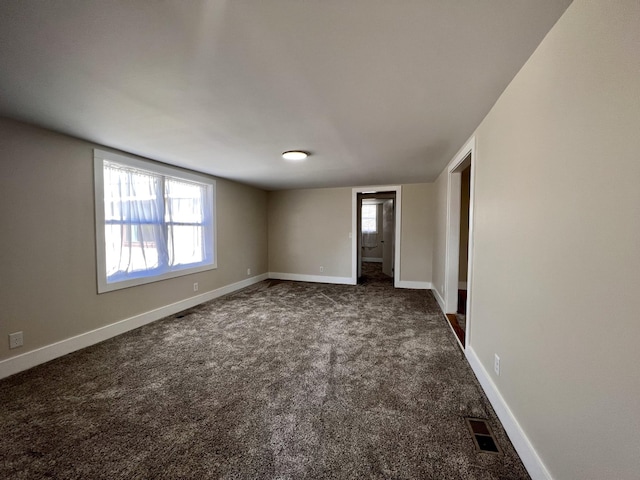 715 Hunt St, Winchester, TN 37398 - unfurnished room with dark colored carpet and baseboards