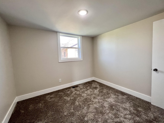 715 Hunt St, Winchester, TN 37398 - spare room featuring dark carpet and baseboards