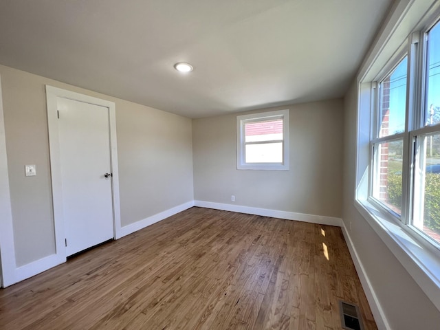 715 Hunt St, Winchester, TN 37398 - spare room featuring baseboards, wood finished floors, and healthy amount of natural light