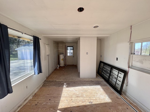 715 Hunt St, Winchester, TN 37398 - entryway with water heater, light wood-style flooring, and healthy amount of natural light