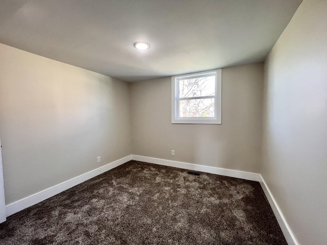 715 Hunt St, Winchester, TN 37398 - empty room with dark carpet and baseboards