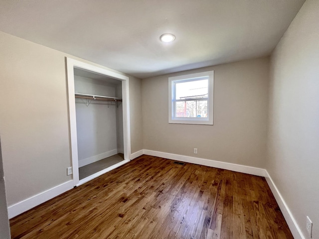 715 Hunt St, Winchester, TN 37398 - unfurnished bedroom featuring wood finished floors, baseboards, and a closet