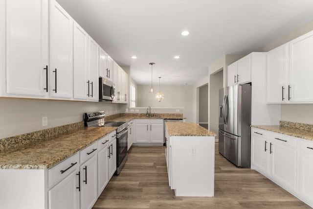 1205 Riverbirch Way, Hermitage, TN 37076 - kitchen featuring stainless steel appliances, a peninsula, a kitchen island, recessed lighting, and a sink