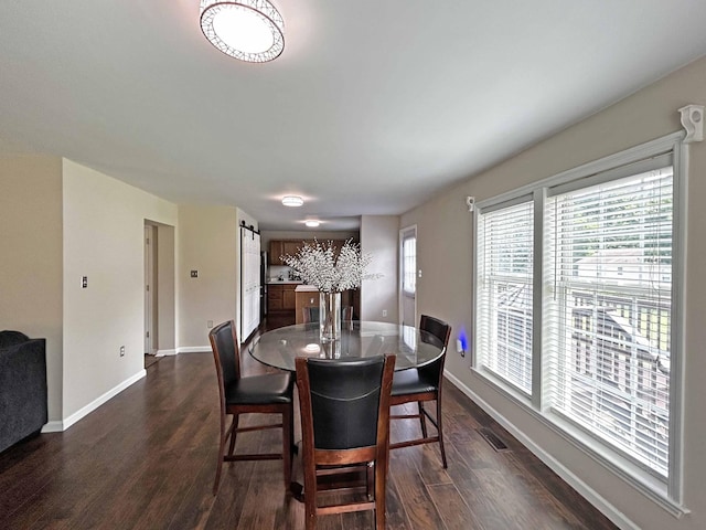305 Wildwood Dr, Smyrna, TN 37167 - dining space featuring dark wood-type flooring and baseboards