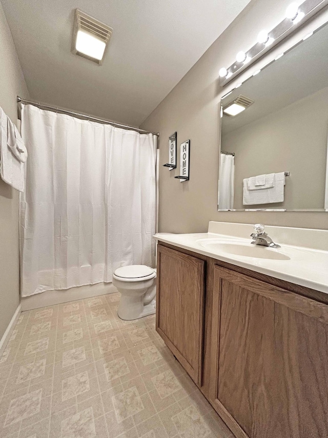 305 Wildwood Dr, Smyrna, TN 37167 - full bathroom featuring vanity, toilet, shower / bath combo with shower curtain, and tile patterned floors
