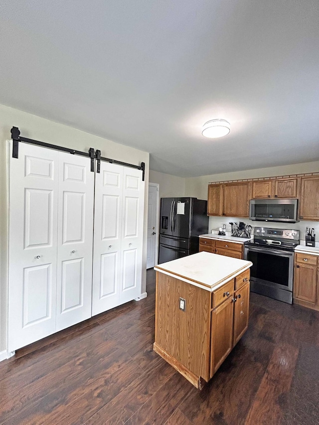305 Wildwood Dr, Smyrna, TN 37167 - kitchen featuring stainless steel appliances, dark wood-style floors, and brown cabinetry