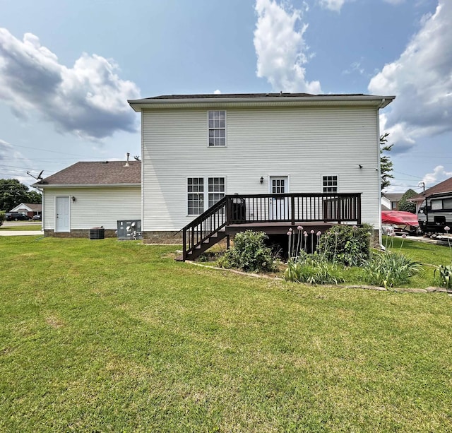 305 Wildwood Dr, Smyrna, TN 37167 - rear view of house with a deck, a yard, and central AC