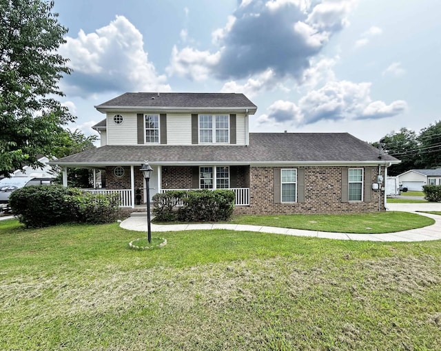 305 Wildwood Dr, Smyrna, TN 37167 - view of front of property featuring a porch, a front yard, a shingled roof, and brick siding