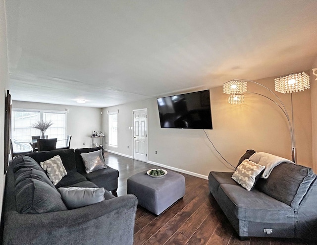 305 Wildwood Dr, Smyrna, TN 37167 - living room featuring dark wood-style floors, baseboards, and a chandelier