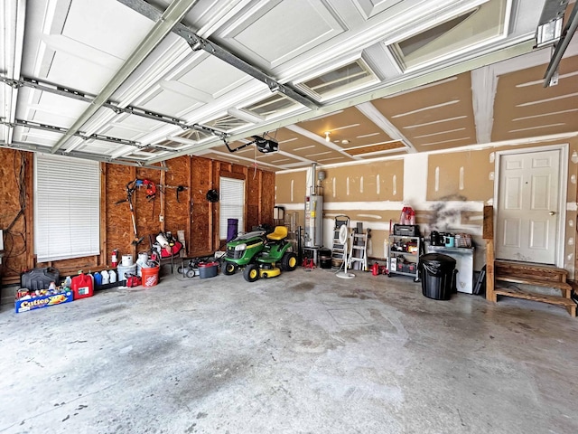 305 Wildwood Dr, Smyrna, TN 37167 - garage featuring a garage door opener and gas water heater